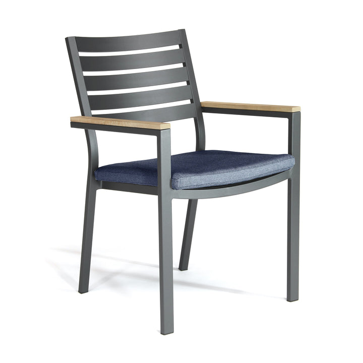 Elba 9-Piece Dining Set, Spectrum Indigo chair with charcoal aluminum frame, teak armrests, and indigo foam cushion.