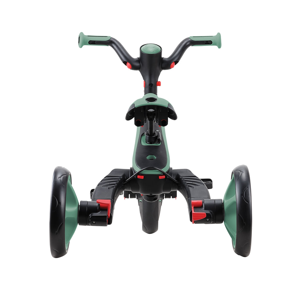 Explorer Trike Foldable 4-in-1 toddler tricycle shown folded with green and black frame and wide wheels.