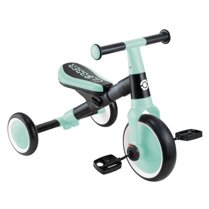 Learning Trike 2-in-1 in mint, durable metal frame, tool-free design, adjustable saddle, pedals, and EVA foam wheels.