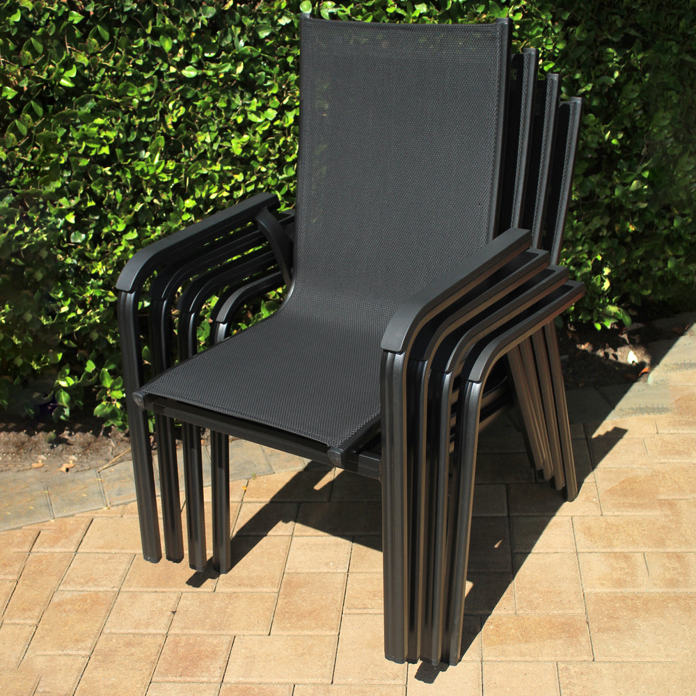 Basic Plus Stackable Arm Chair - Set Of 4 in grey with lightweight aluminum frame and breathable textile sling material.
