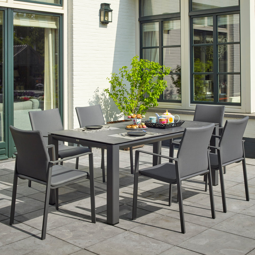 Dine alfresco in style with the Sense Dining Set. The sleek profile of the table and chairs give a clean, contemporary look. The dining chairs feature an aluminum frame with ergonomic arm rests and a comfortable all-weather sling with quick dry foam filling and all weather upholstery fabric. The ceramic top aluminum table is sturdy and weather resistant, ensuring years of outdoor dining enjoyment.