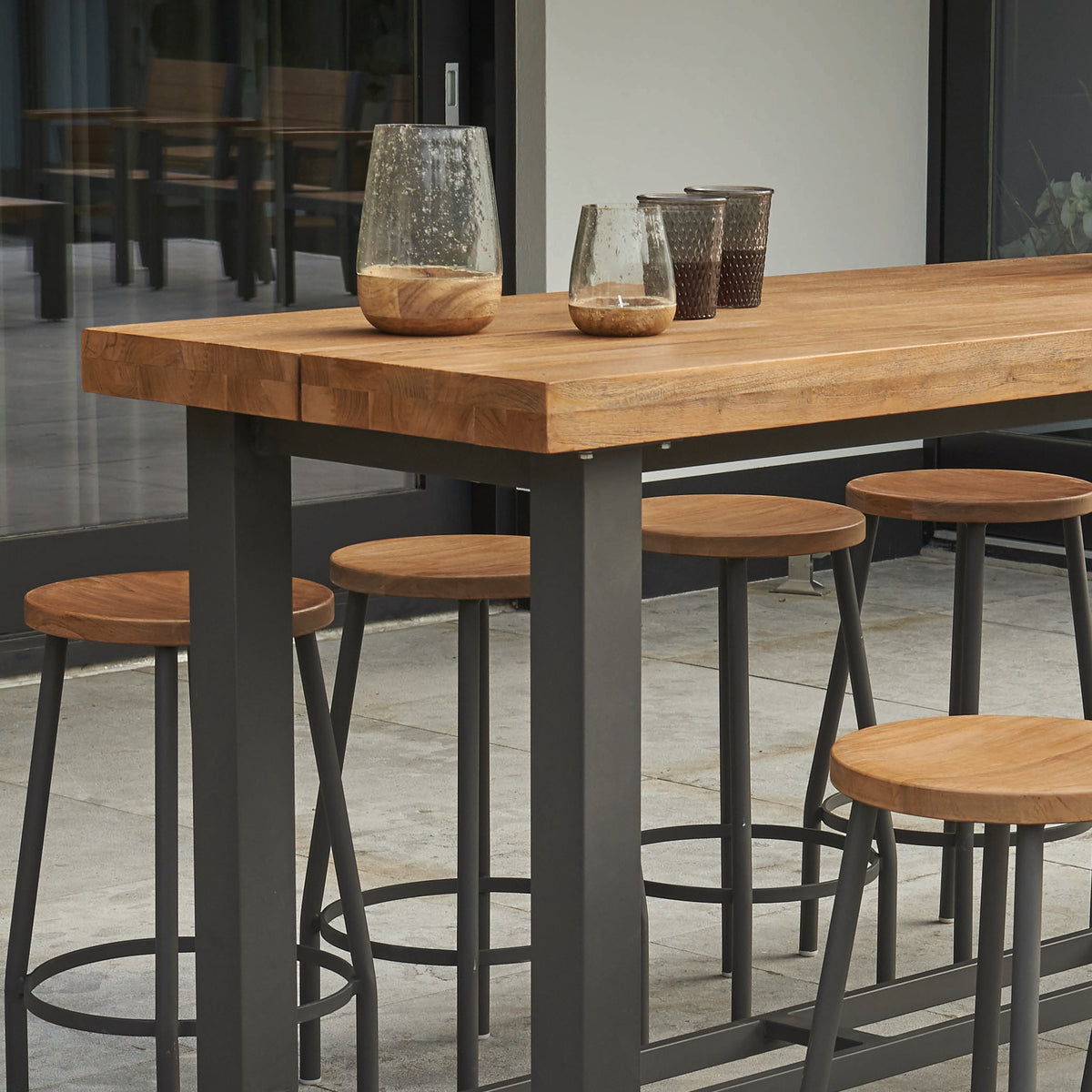 Teak accents with aluminum frame create a great modern look for your patio furniture.