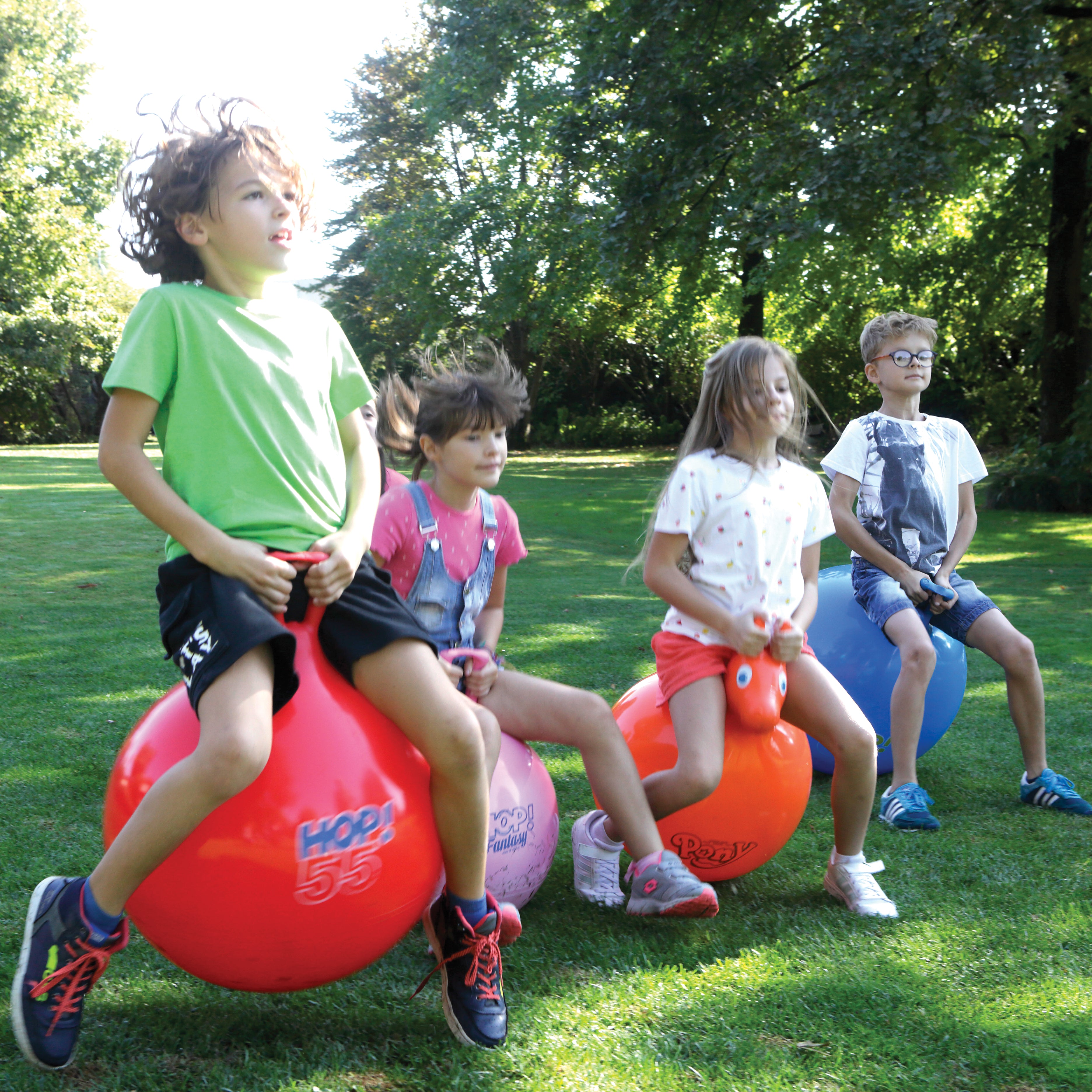 Children playing on the hop balls