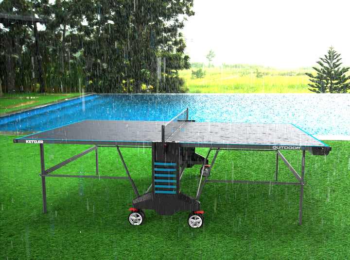 Outdoor 4 Table Tennis Table - 2-Player Bundle shown outside in rain, demonstrating weatherproof durable design.