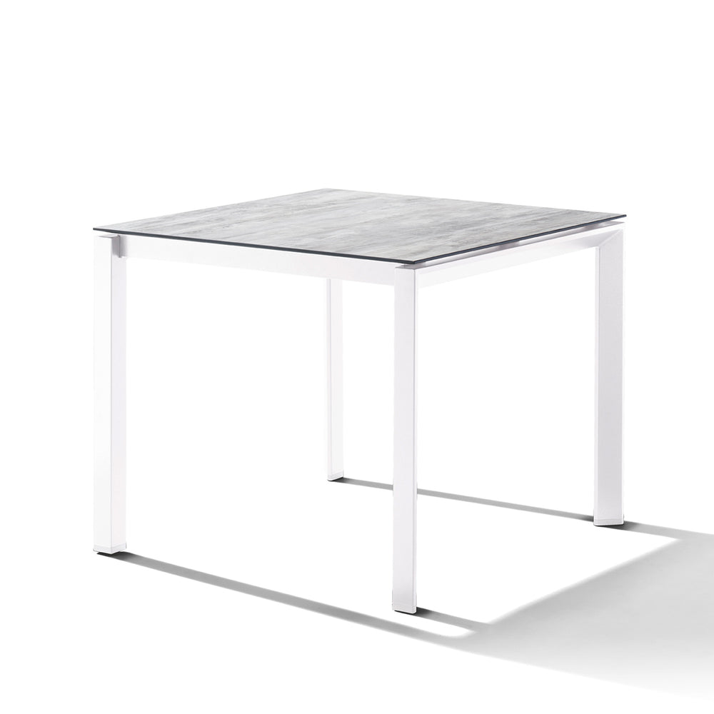 Polytec® Loft Tables with weatherproof 10mm HPL beveled top and sturdy white powder-coated aluminum frame.