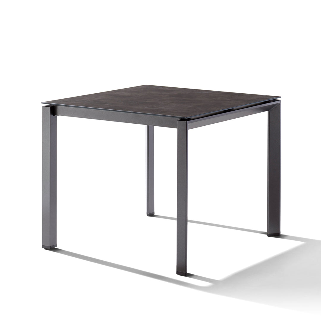 Polytec® Loft Tables with durable dark concrete HPL top and sturdy iron grey powder-coated aluminum frame for outdoor use