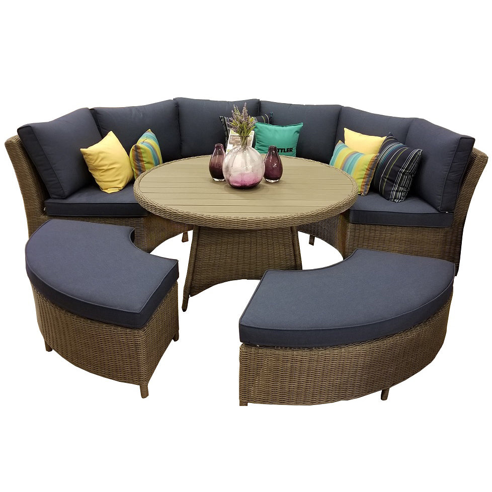 Palma Wicker Round Lounge Set with dark oak round table, curved wicker sofas, benches, and blue cushions.