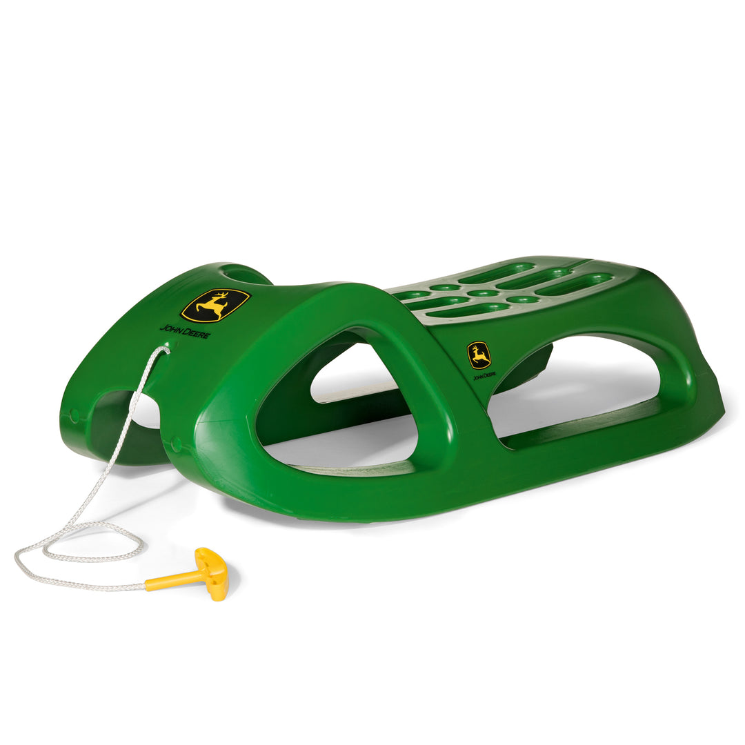 John Deere Snow Cruiser Sled By Rolly Toys in green resin with steel runners and nylon tow rope for smooth snow rides.