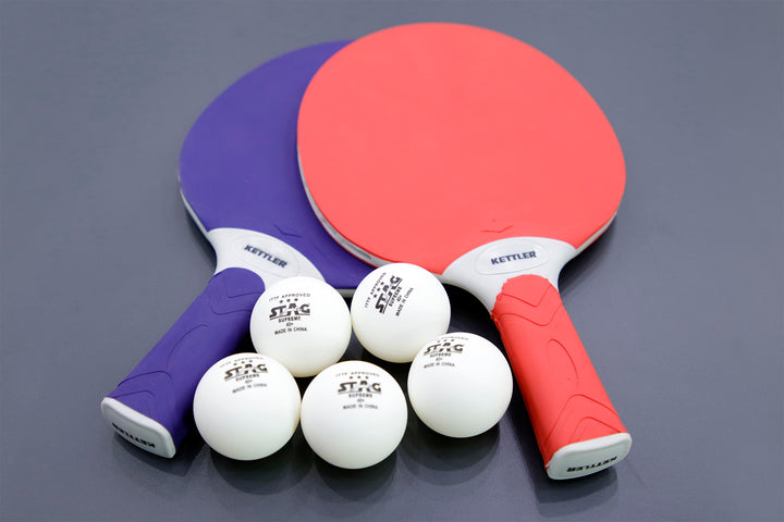 Outdoor 4 Table Tennis Table - 2-Player Bundle with two paddles and six 3-star balls on a gray surface.