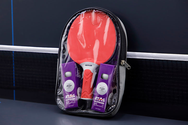 Outdoor 4 Table Tennis Table - 2-Player Bundle with rackets and balls in compact zippered carrying case on table tennis surface.