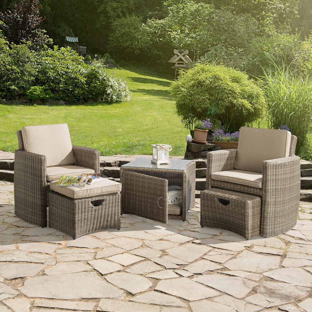 Cupido Wicker 2-Person Conversation Set With Cushions outdoor patio set with wicker chairs, ottomans, and glass side table.