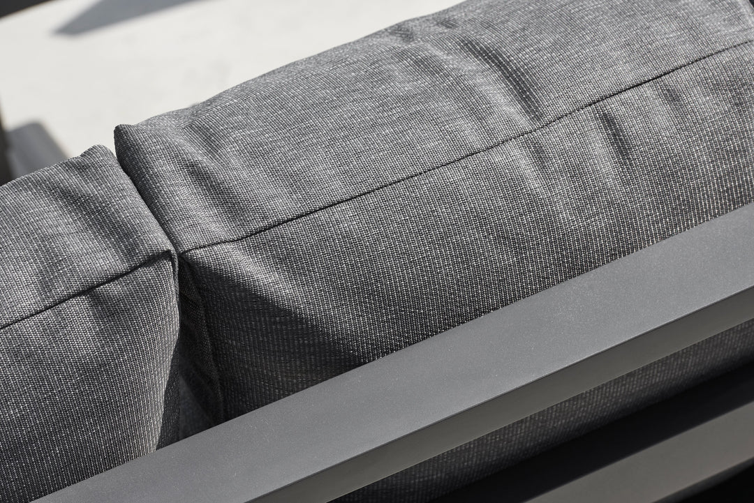 Timber Corner Conversation Set showing close-up of charcoal Sunbrella cushion fabric and lava frame detail.