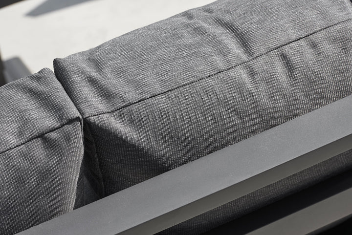 Timber Corner Conversation Set showing close-up of charcoal Sunbrella cushion fabric and lava frame detail.