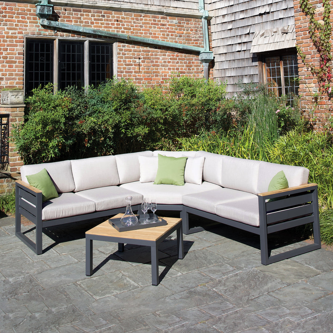 29-inch Elba Comfort Aluminum Coffee Table With Teak Top in charcoal frame and teak top on outdoor patio.