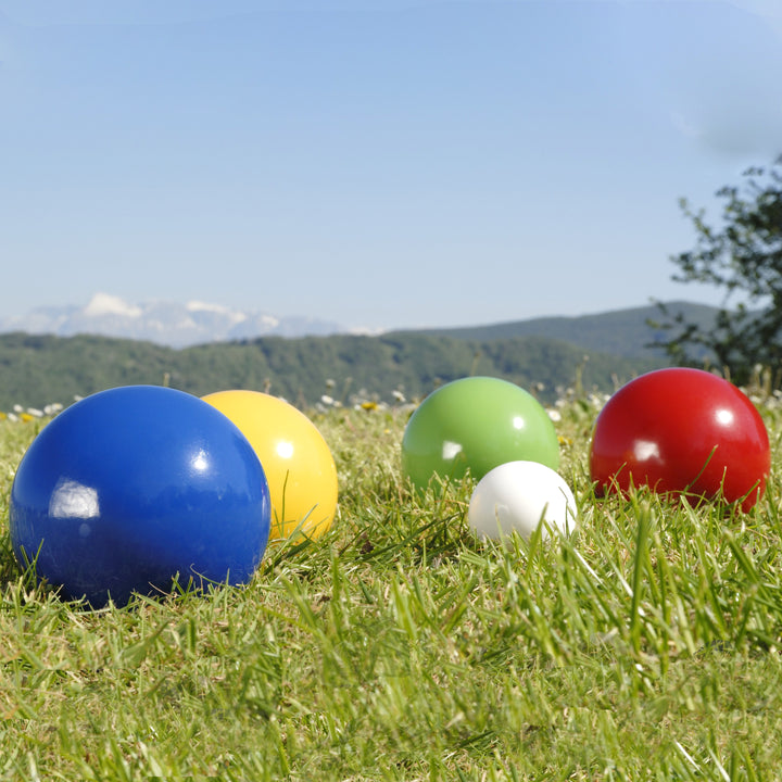 Junior Bocce Set with colorful lacquered balls and jack ball on grass ready for outdoor lawn play.