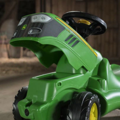 John Deere Minitrac Foot To Floor Ride-On with opening hood, squeaky horn, and knee indention for toddlers.