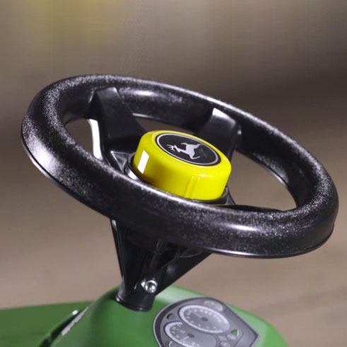 Lifestyle image of the John Deere Mini Trac Steering Wheel.