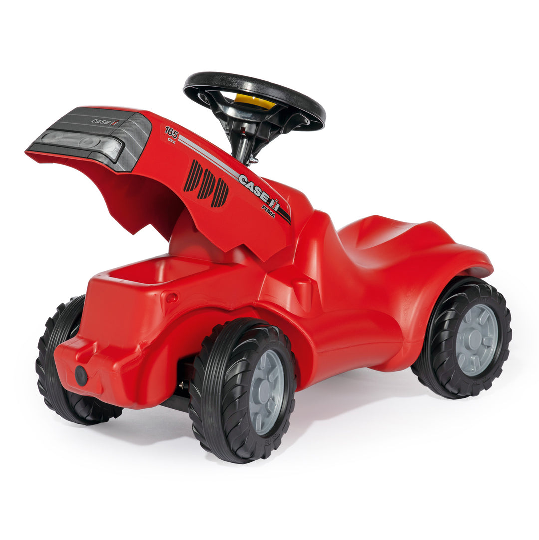 Case IH Minitrac red ride-on toy with opening hood, squeaky horn, knee indention, and durable resin tires for kids.