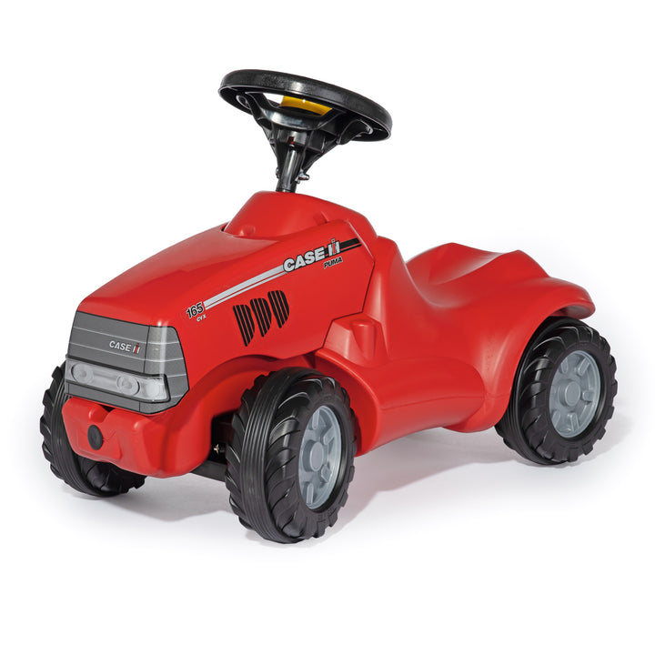 Red CASE IH Minitrac ride-on toy with steering wheel, durable tires, and comfortable scooting design for toddlers.