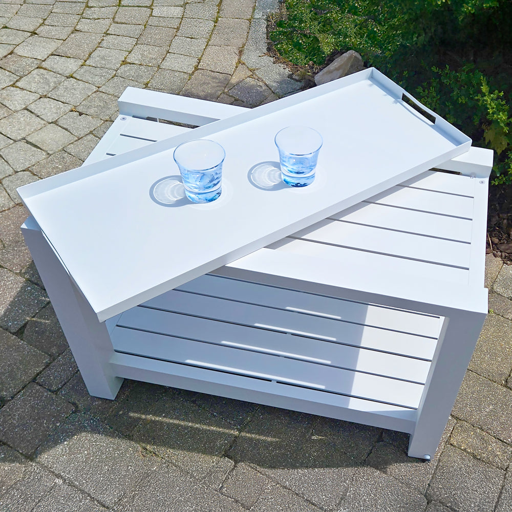 Easy Serving Trolley - Aluminum in white with removable tray and two glasses on outdoor patio surface.