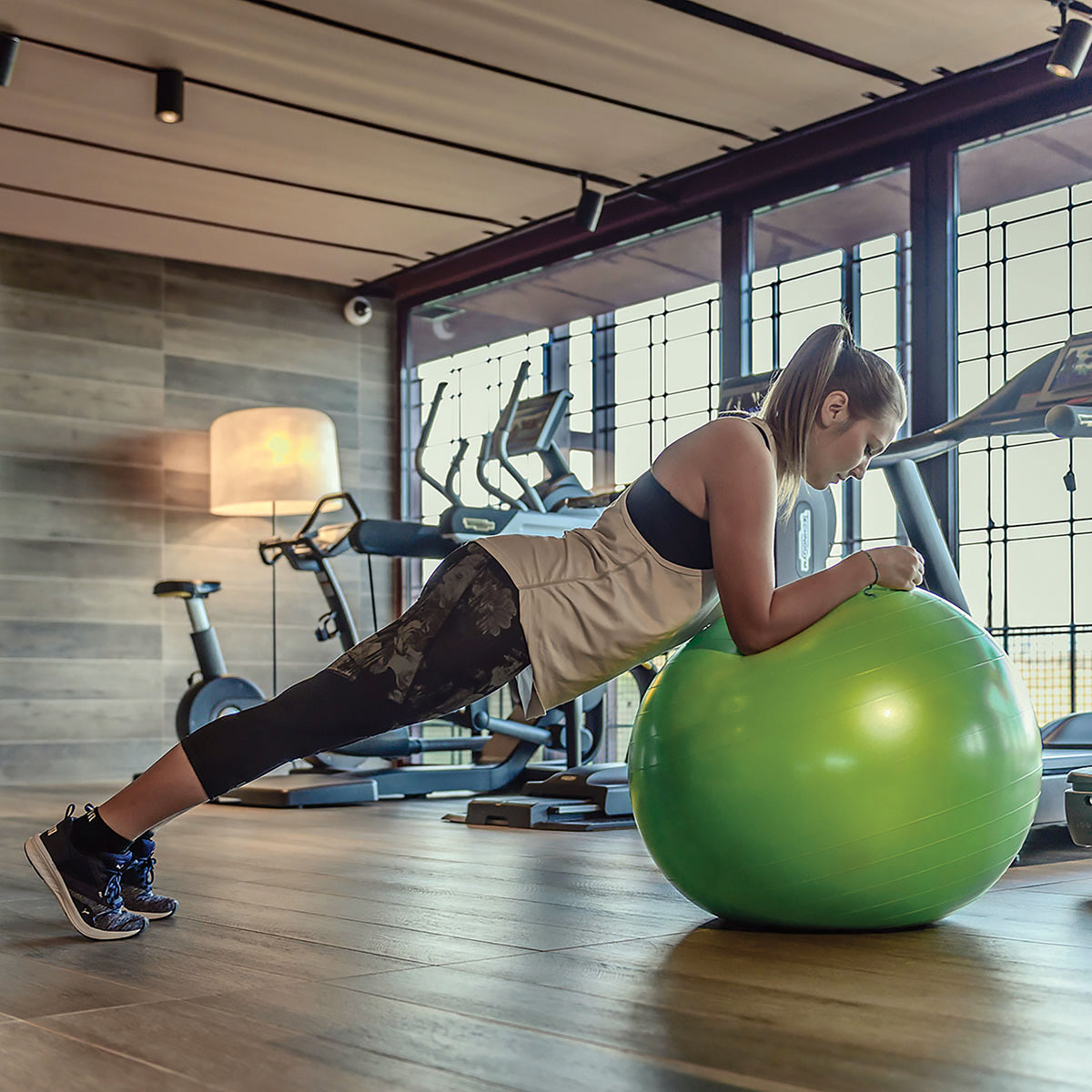 KETTLER fitness equipment. Girl balances on fitness ball.