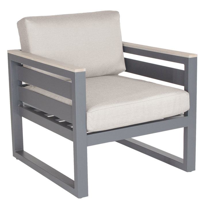 Elba Comfort Lounge Set chair with charcoal aluminum frame, teak armrests, and cast silver Sunbrella cushions.