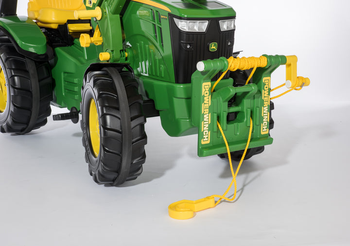 Toy tractor with a tow bar on a white background