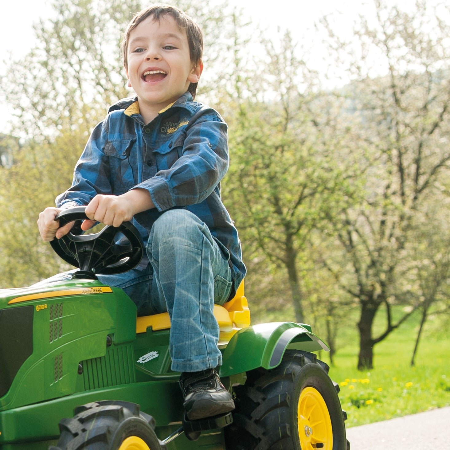 Let your child's imagination soar with the John Deere Farm Tractor. This impressive pedal powered ride on tractor comes complete with front loader that can be raised and lowered, scooped and tipped using the levers. The oversized rubber air tires are long lasting and provide a smooth ride.