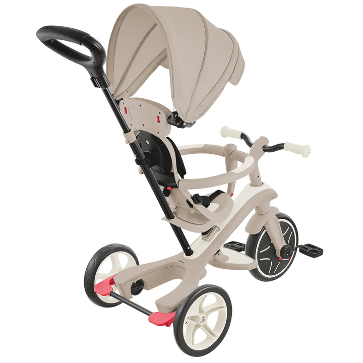 Explorer Trike Eco 4-in-1 beige push tricycle with adjustable canopy, parent handle, safety harness, and EVA foam wheels.
