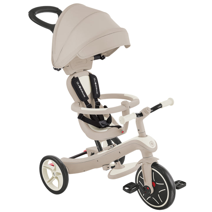 Explorer Trike Eco 4-in-1 in beige with adjustable canopy, safety harness, and ergonomic handlebars for children 10 months to 5 years.