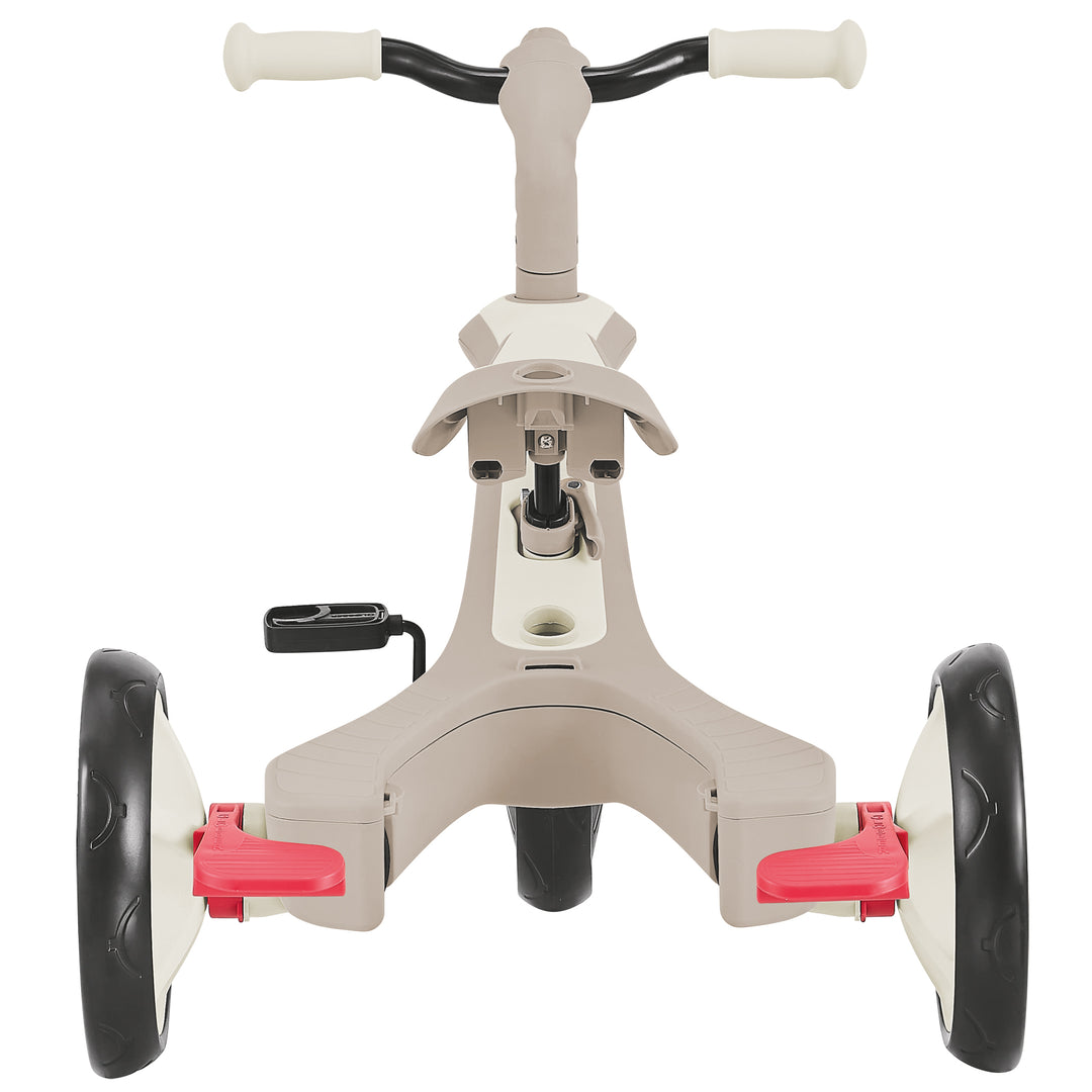 Explorer Trike Eco 4-in-1 beige and black toddler tricycle with red pedals and sturdy EVA foam wheels.