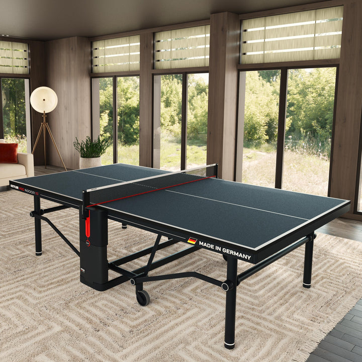 KETTLER Pro Indoor 15 Table Tennis Table in modern room with foldable design and durable IN-TEC22 top, made in Germany.