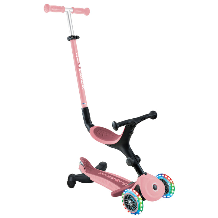 Go Up Active 360 Scooter in pastel pink with light-up wheels, adjustable seat, and 3-wheel design for kids ages 3-9.