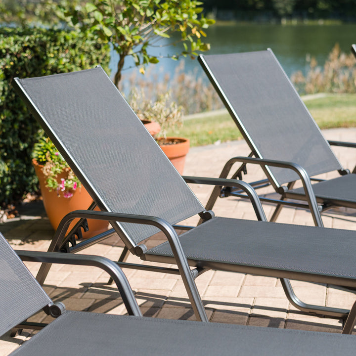 Basic Plus Stackable Loungers in grey with anthracite aluminum frame and textilene sling, ideal for outdoor relaxing seating.