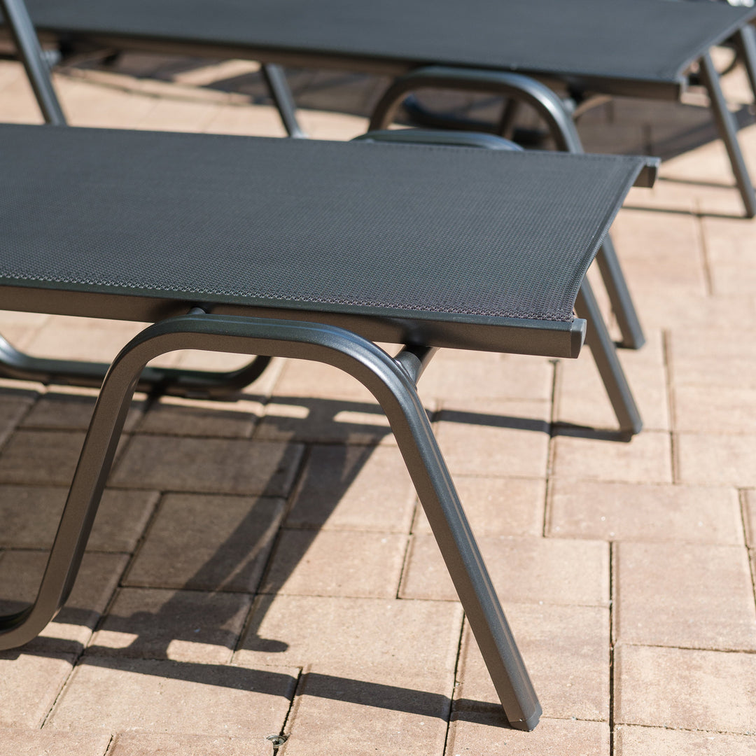Basic Plus Stackable Loungers in grey with powder-coated aluminum frame and quick-drying textile sling for outdoor use.
