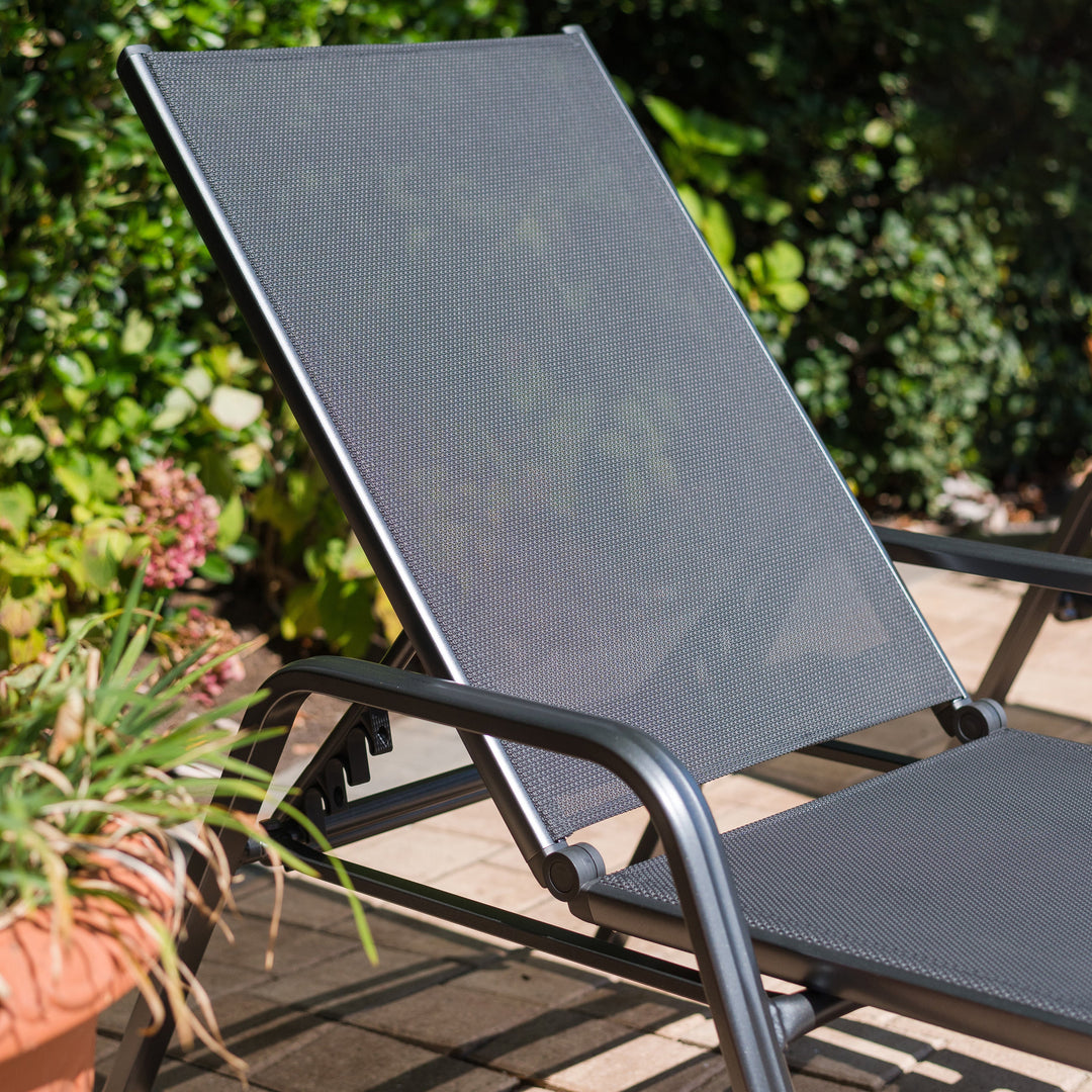 Basic Plus Stackable Loungers in grey with powder-coated aluminum frame and quick-drying Textilene sling for outdoor comfort.