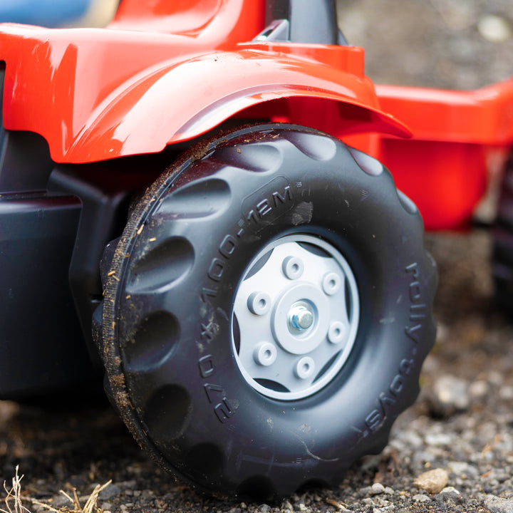 Close-up of oversized tire on Case IH Tractor With Trailer designed for children’s play and durability.
