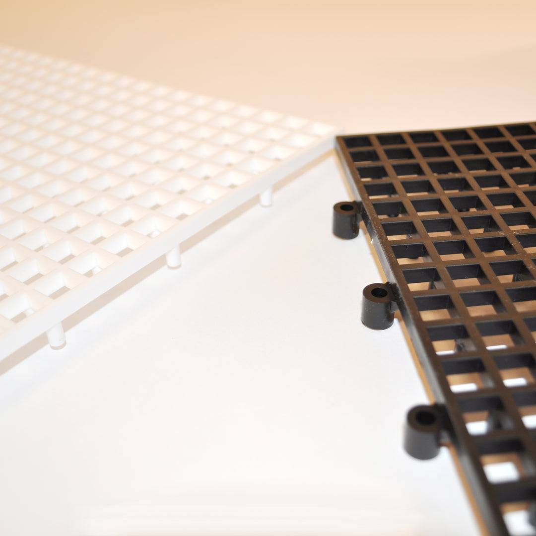 Giant 10x10 Tile Game Board showing snap together black and white polyethylene resin pieces for oversized chess or checker sets.
