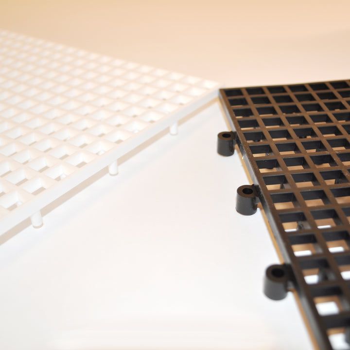Giant 10x10 Tile Game Board showing snap together black and white polyethylene resin pieces for oversized chess or checker sets.