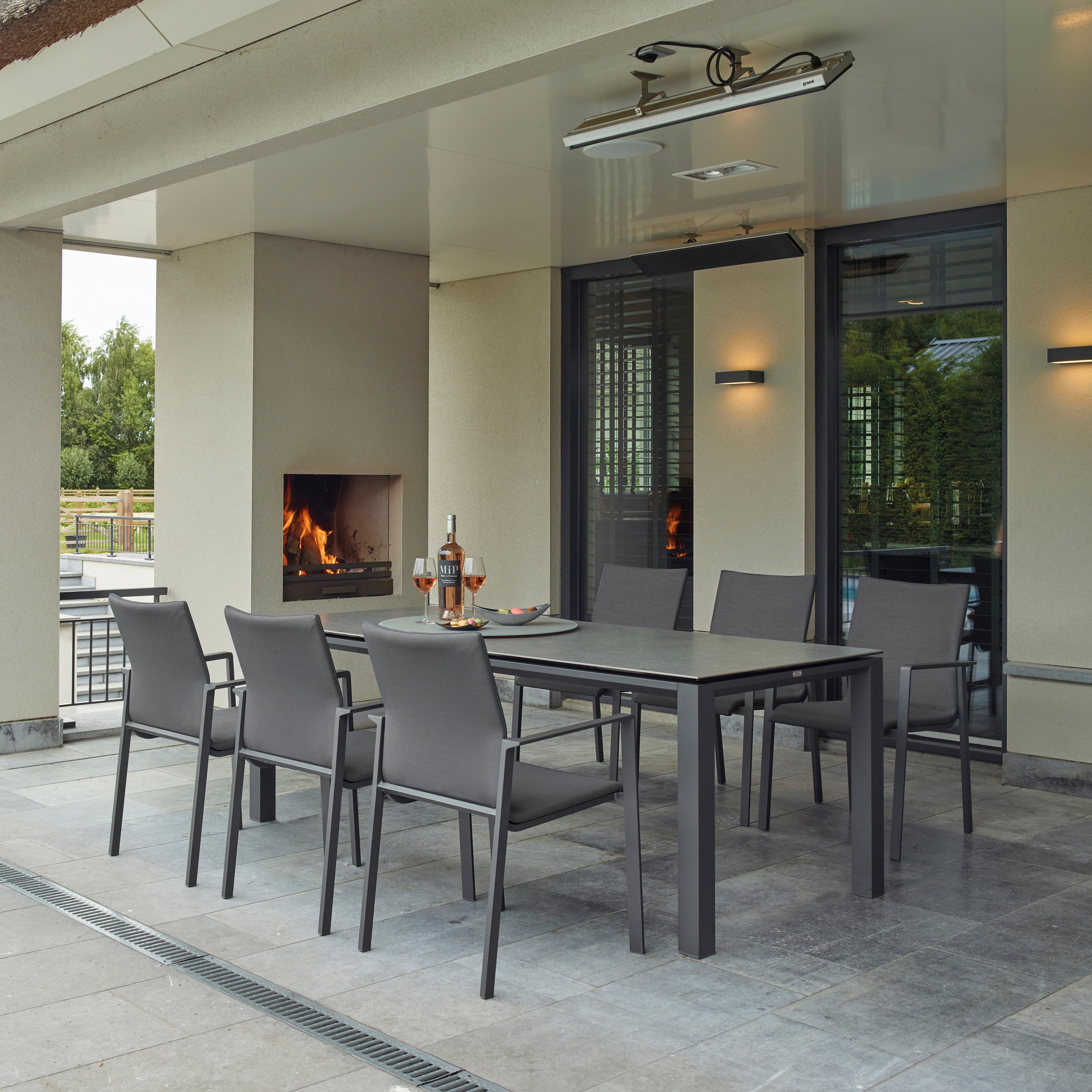 Dine alfresco in style with the Sense Dining Set. The sleek profile of the table and chairs give a clean, contemporary look. The dining chairs feature an aluminum frame with ergonomic arm rests and a comfortable all-weather sling with quick dry foam filling and all weather upholstery fabric. The ceramic top aluminum table is sturdy and weather resistant, ensuring years of outdoor dining enjoyment.