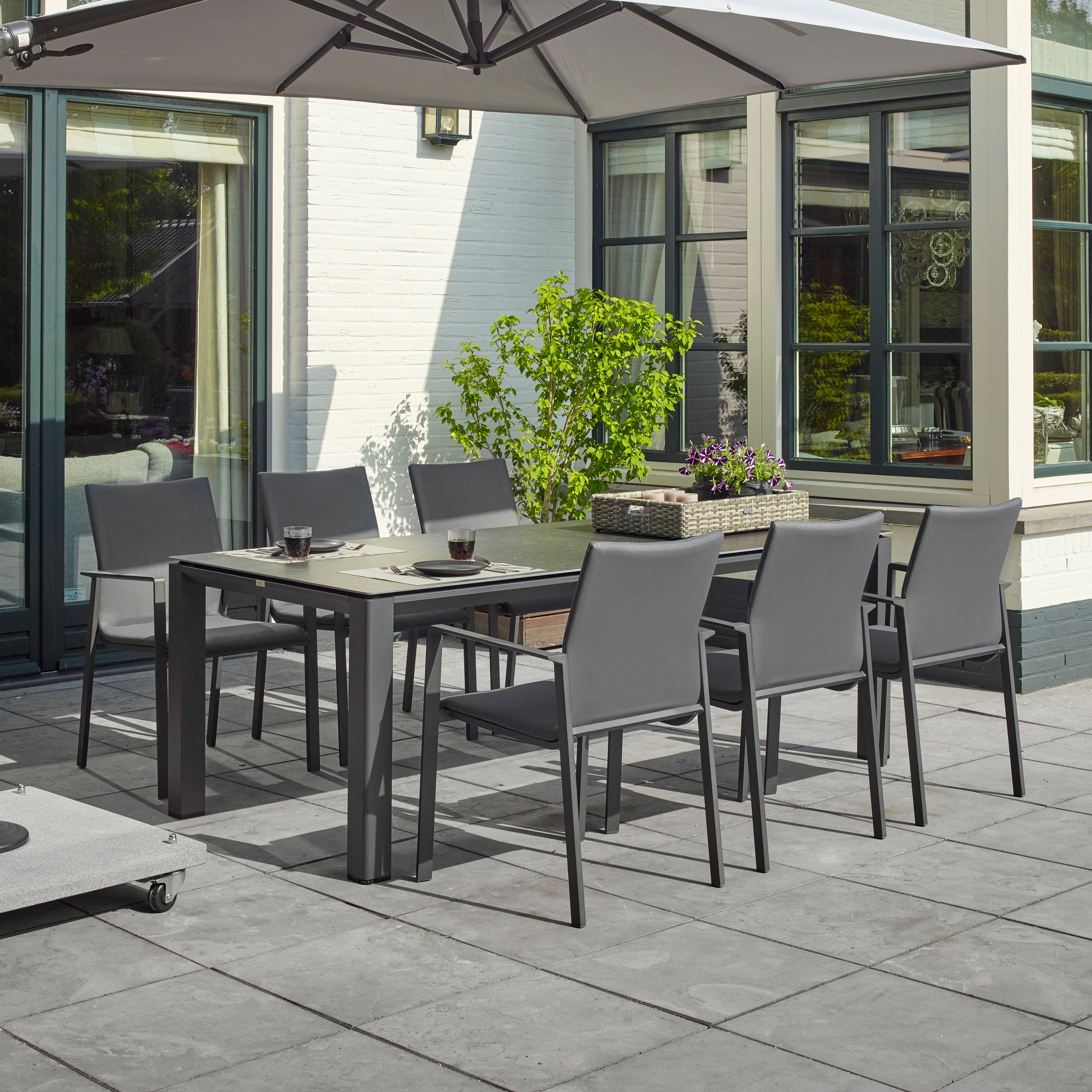 Dine alfresco in style with the Sense Dining Set. The sleek profile of the table and chairs give a clean, contemporary look. The dining chairs feature an aluminum frame with ergonomic arm rests and a comfortable all-weather sling with quick dry foam filling and all weather upholstery fabric. The ceramic top aluminum table is sturdy and weather resistant, ensuring years of outdoor dining enjoyment.