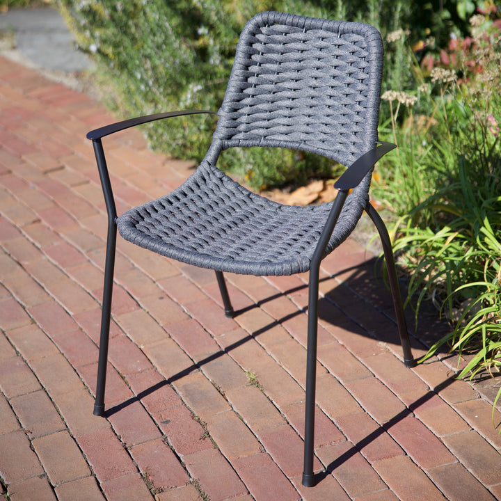 Metro Rope Stackable Arm Chair in gray weather-resistant rope with iron gray frame, curved back and armrests for comfort.