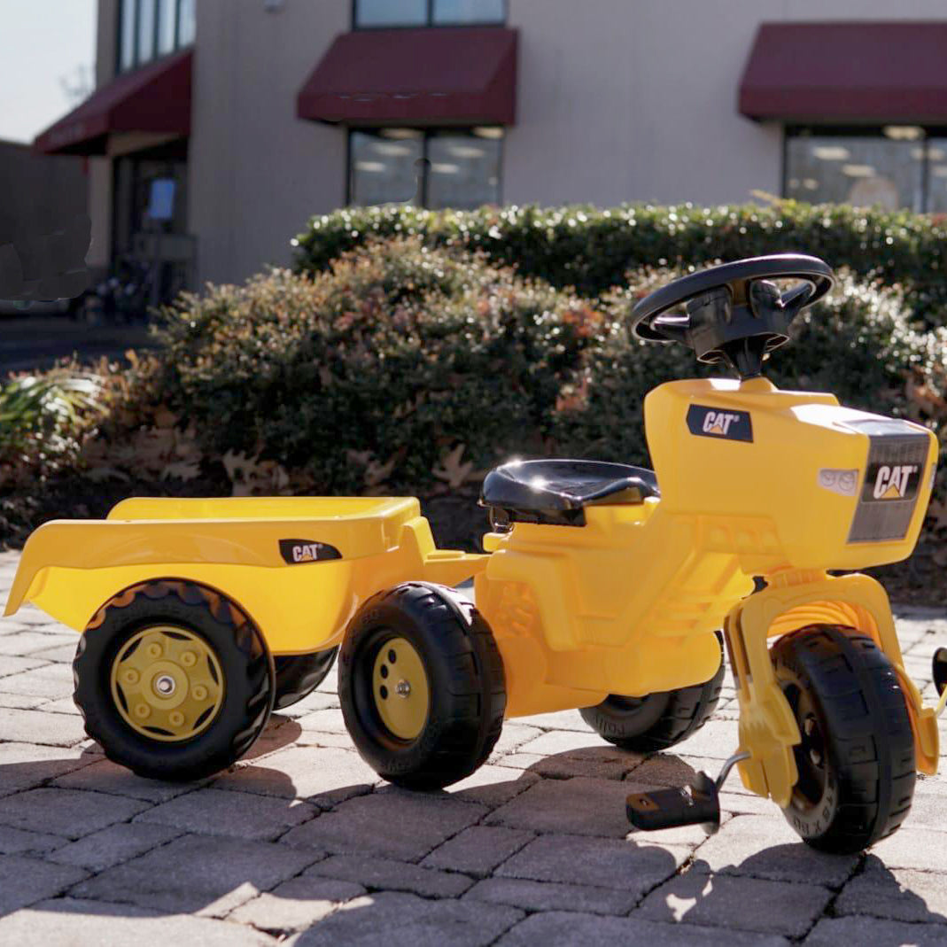 This CAT® Pedal Vehicle is on three wheels so it rides like a Tricycle with the look of a tractor