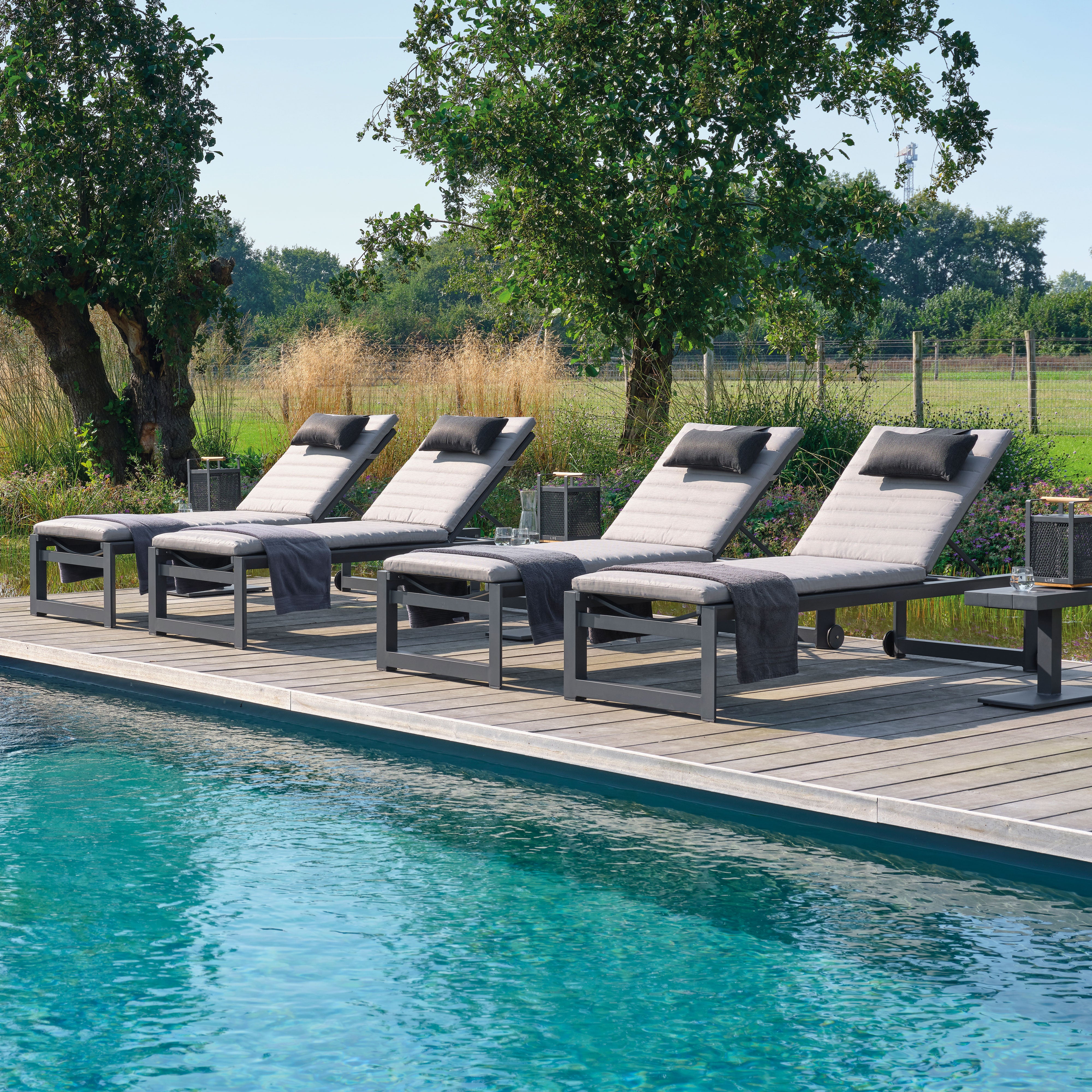 The integrated wheels in the back legs of the slim profiled Delta High Multi-Position Lounger makes it easy to move around your pool side or patio. The multi-position feature allows you to quickly adjust the back of the lounger and recline to your desired position.