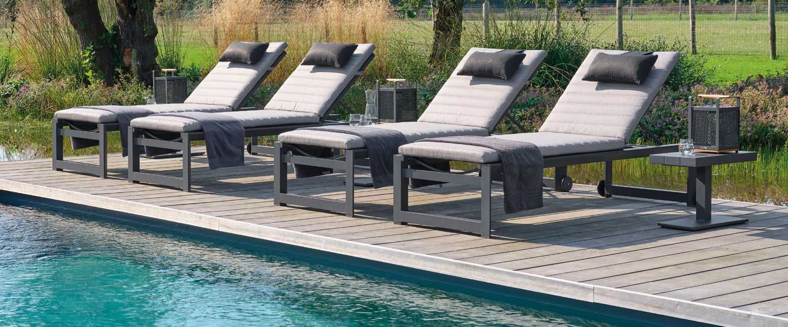 The integrated wheels in the back legs of the slim profiled Delta High Multi-Position Lounger makes it easy to move around your pool side or patio. The multi-position feature allows you to quickly adjust the back of the lounger and recline to your desired position.
