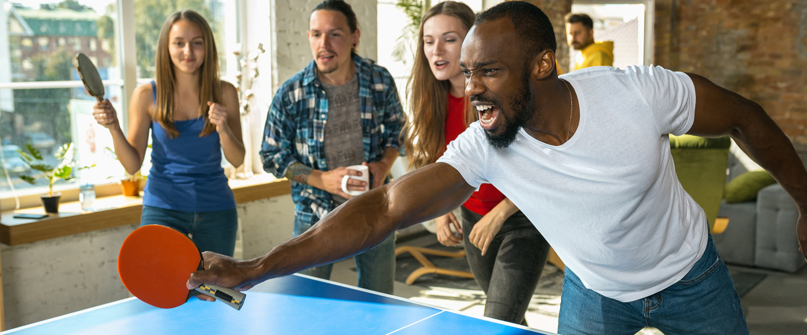 Teens playing Table Tennis having fun
