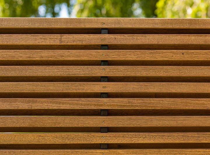 Close-up view of the durable, robust wooden slats of the Java Teak Room Divider in outdoor setting.
