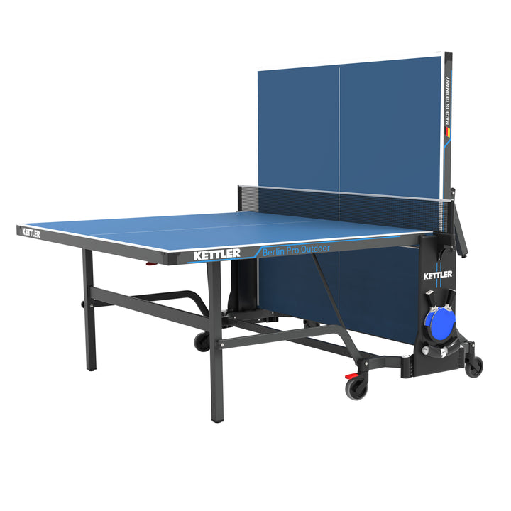 Berlin Pro Outdoor Table Tennis Table 4-Player Bundle with weatherproof top, locking mechanism, net, rackets, balls, and cover.
