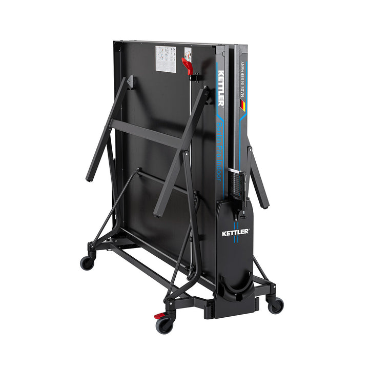 Folded Berlin Pro Indoor Table Tennis Table with wheels and secure locking mechanism for easy storage and transport