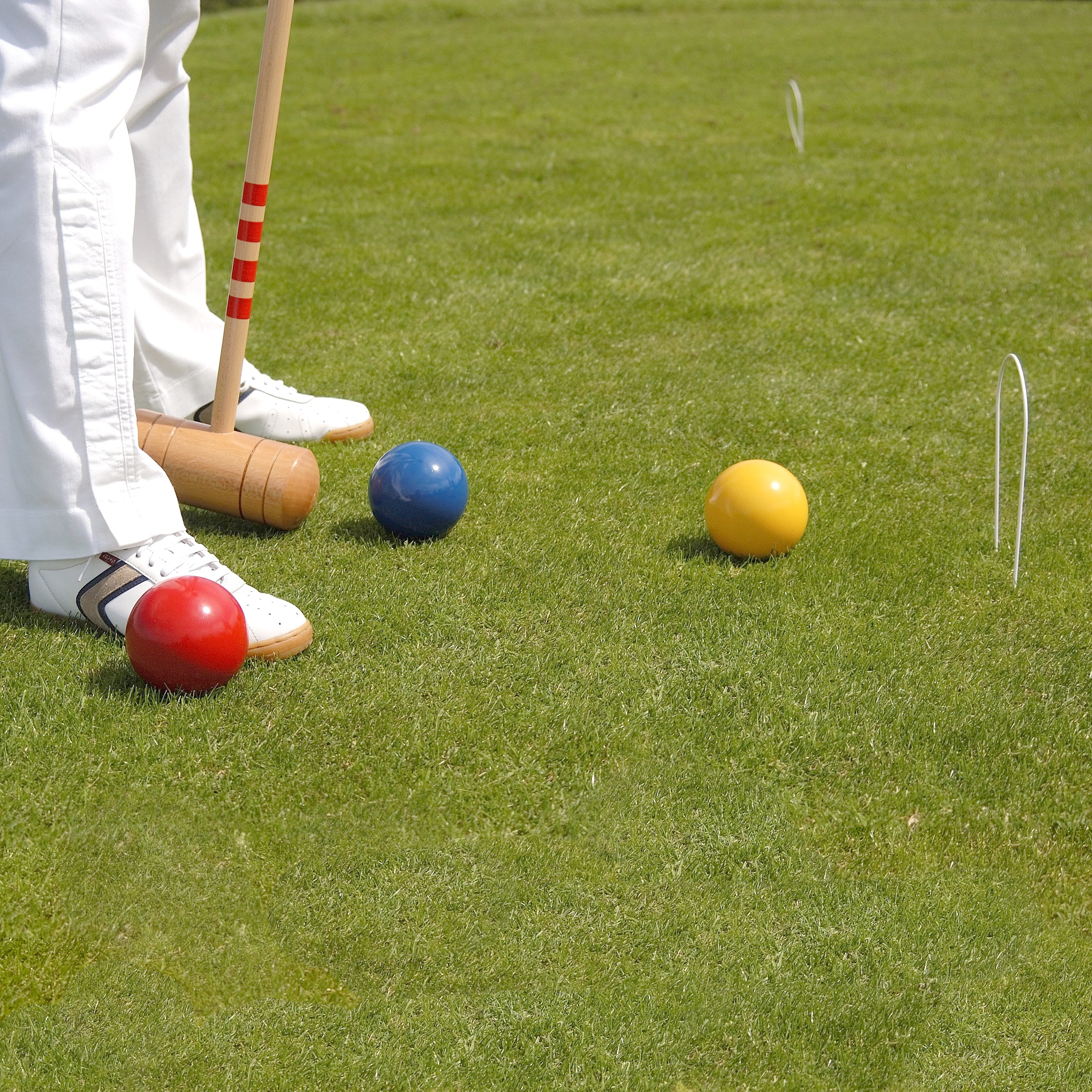 Lifestyle image of people playing the 4 Player Croquet Set